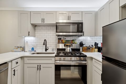 Updated well stocked kitchen with stainless steel appliances