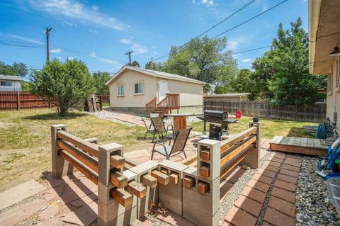 Private backyard oasis, perfect for unwinding and entertaining. Please note, the garage in the background is for storage only and not accessible to guests.