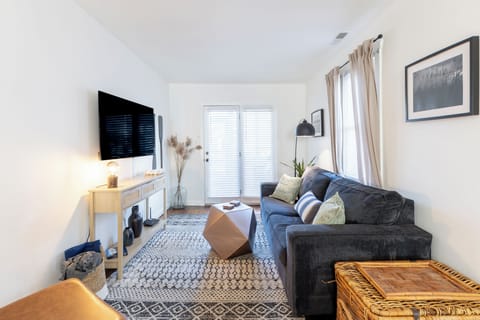 Relax and unwind in our cozy living room complete with a 55" TV.