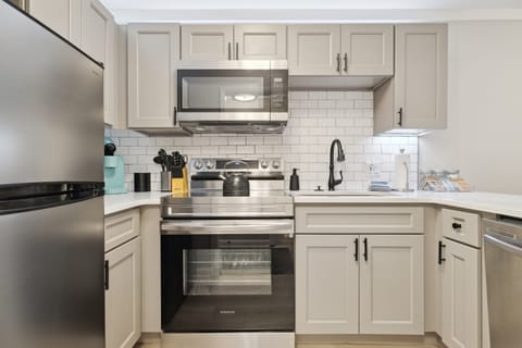 Updated well stocked kitchen with stainless steel appliances