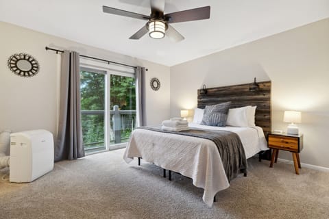 First bedroom includes a queen bed, Roku TV, and private balcony