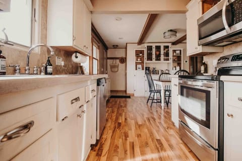 Fully stocked kitchen with working oven, stovetop, full-size fridge/freezer and dishwasher. 