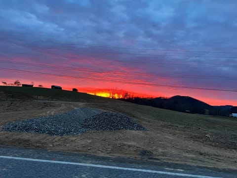 Amazing sunrise on the property! The cabins sit on the ridge to the left.