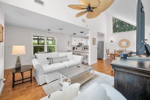 Spacious, breezy BUNGALOW with open layout. Cozy living room with plush seating & HD flatscreen TV. Bright, airy, and perfect for relaxing or entertaining.