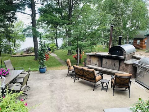 Patio area outside the main house overlooking the lake and boathouse.