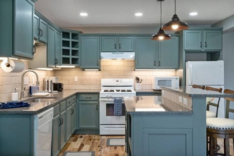 The full kitchen is stocked with all of the essentials! Spices, pans, pots, cooking sheets, and utensils.