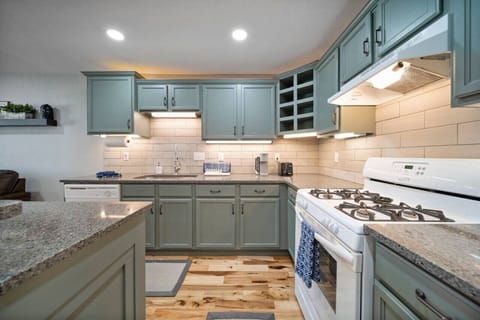 The full kitchen is stocked with all of the essentials! Spices, pans, pots, cooking sheets, and utensils.