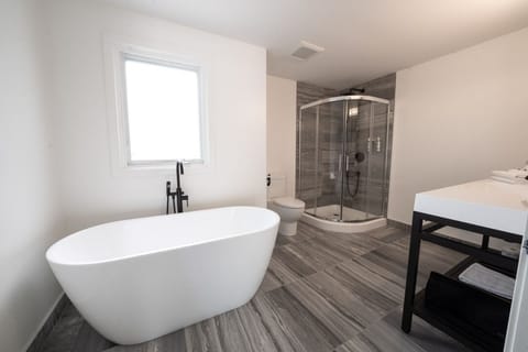 Deluxe King The Palms | Bathroom | Designer toiletries, hair dryer, towels, soap