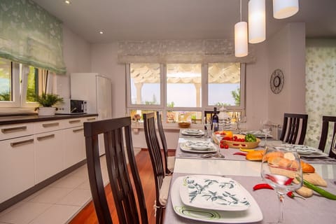 air-conditioned living and dining area with a fully equipped kitchen