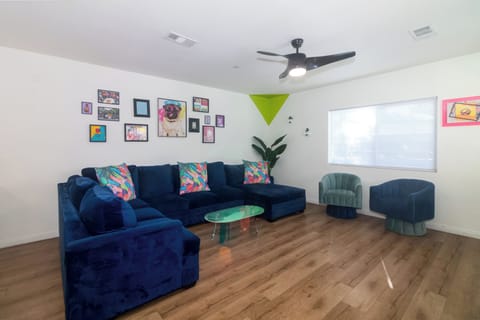 Spacious living area with plenty of seating to relax and enjoy your shows.