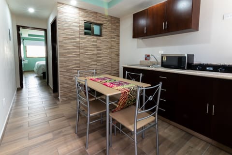 Family Suite | Private kitchen | Fridge, microwave