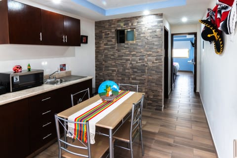 Deluxe Room | Private kitchen | Fridge, microwave