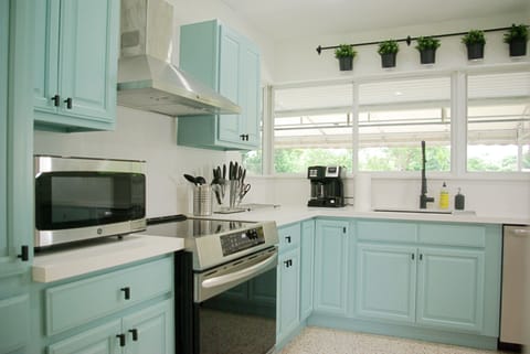 Freshly renovated kitchen with view of rear patio. Induction cooktop & air fryer