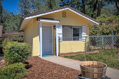 Front of cottage with fenced front yard