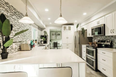 High-end gourmet kitchen with all new appliances and cabinets. Perfect for the guests to like to cook!