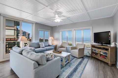 Spectacular Oceanfront Views from this Sunny Sea Dunes End Unit! Living Space with 2 Sofas, Swivel Glider Chairs, Flat Screen Smart TV and Balcony Access
