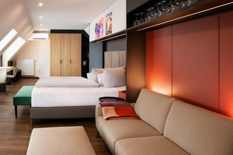 Superior Studio Suite | Living area | 65-inch Smart TV with satellite channels, TV, Netflix