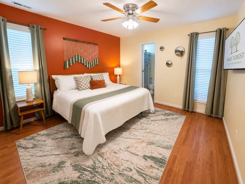 This plush king size bed, with adjustable bed frame, is just waiting for you to sink into it.