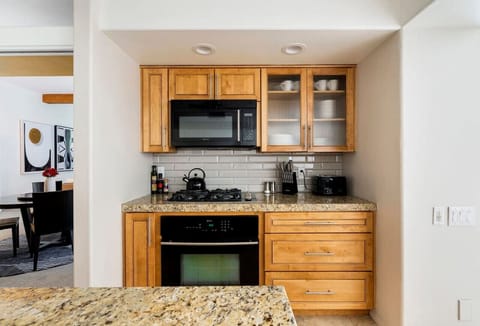 A cozy and modern kitchen corner designed for effortless cooking and style