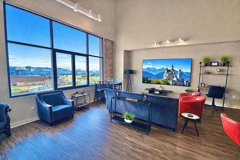 Open-concept living area with cozy seating, modern finishes, and plenty of space to unwind. Ideal for groups to relax and enjoy time together.