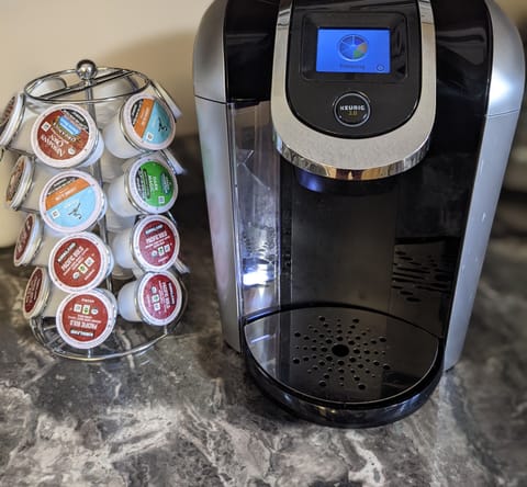 Regular drop coffee maker with ground coffee and filters, sugar and tea