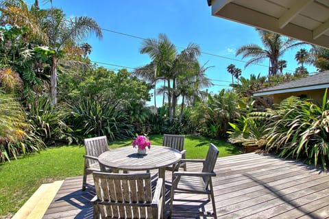 Relax in a tropical oasis and enjoy a meal or take in the south facing sun.
