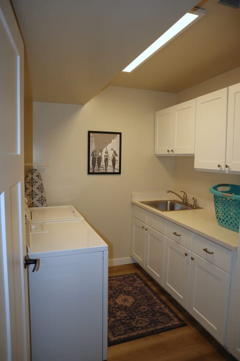 Laundry room w/ washer, drier and detergent provided.
