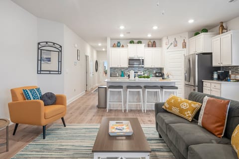 living room with open floor plan fully stocked kitchen