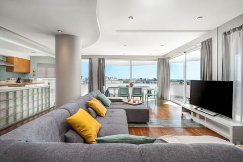 Open space living room with panoramic sea view (old sofa)