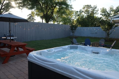 Six Person Hot Tub in the backyard