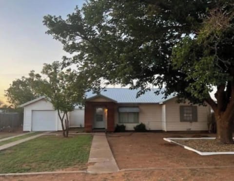 Three bedroom, furnished kitchen, living room, dining room, attached garage.