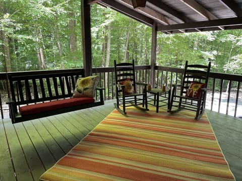 Swing and rocker area of covered porch
