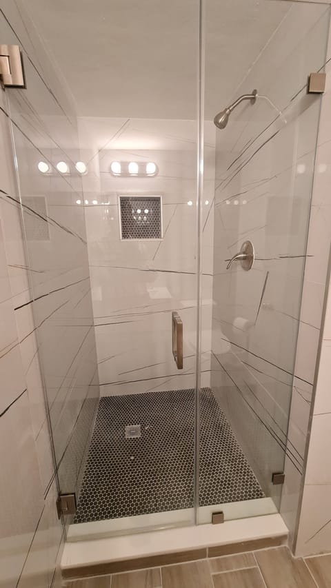 Shower, rainfall showerhead, towels