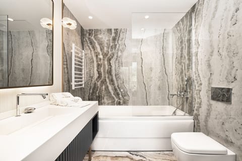 Designer toiletries, hair dryer, bathrobes, slippers