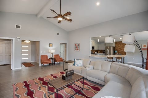 living area with sofa with electric recliners