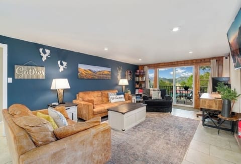 Welcome!   Main level living/tv room with fireplace, tv and desk
