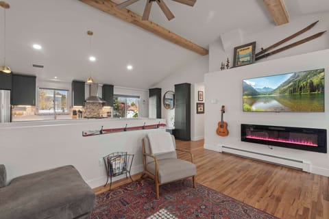 1 of 2 fireplaces. 65" Smart TV