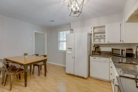 There is a table for 4 to enjoy a meal.