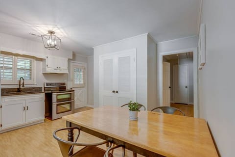 The washer and dryer are in the closet of the kitchen.