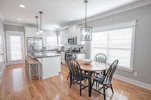 Seating for 4 at the table and two at the bar.