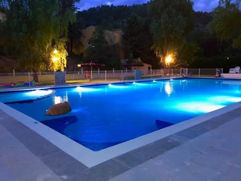 Seasonal outdoor pool, open 11:00 AM to 8:00 PM, pool umbrellas