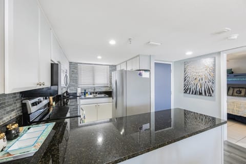 The kitchen and guest bedroom entry