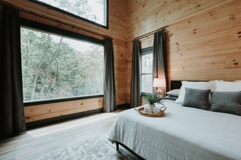 Huge windows to view nature while you are relaxing in bed.