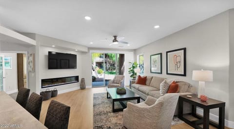 Living room with access to outdoor patio