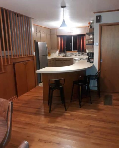 The kitchen is equiped with microwave, fridge, ice maker, and original oven.