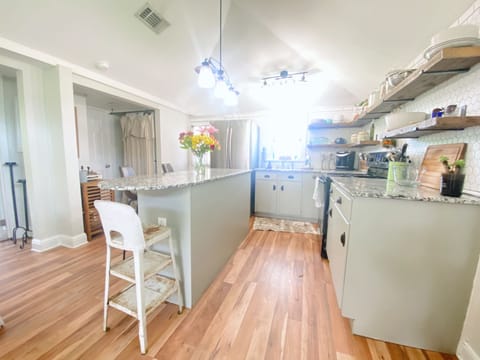 Full kitchen with island, full refrigerator, stove, oven, and microwave!