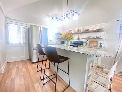 Full kitchen with island, full refrigerator, stove, oven, and microwave!
