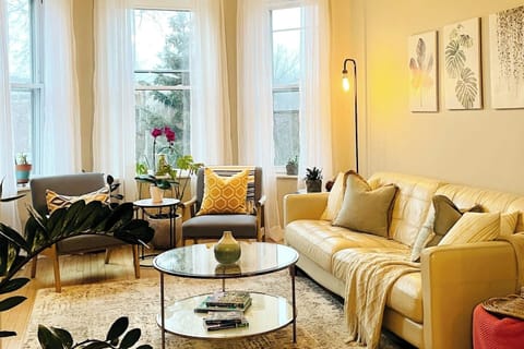 Open living space filled with natural light and cozy seating.