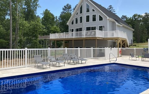 Heated salt water pool with fence, great times for the family.  Lakefront home!
