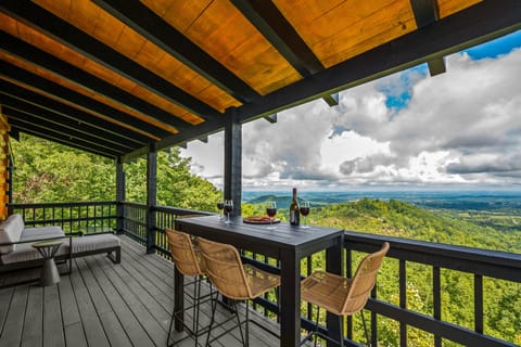 Enjoy cocktails and snacks at this high-top bistro table overlooking the view! 